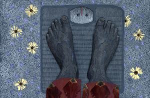 Zwei Füße sind auf einer Personenwaage zu sehen.